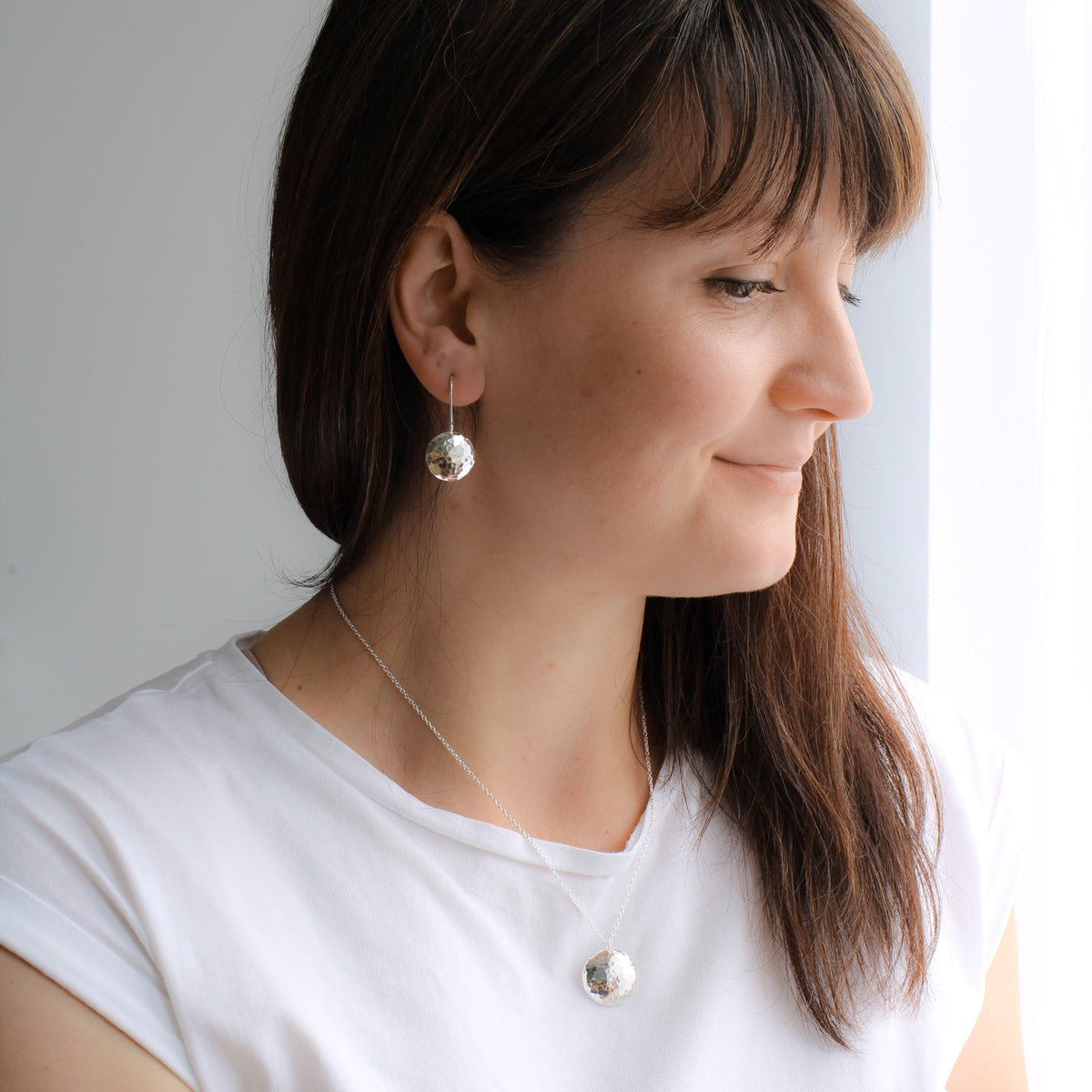Silver hammered disc earrings