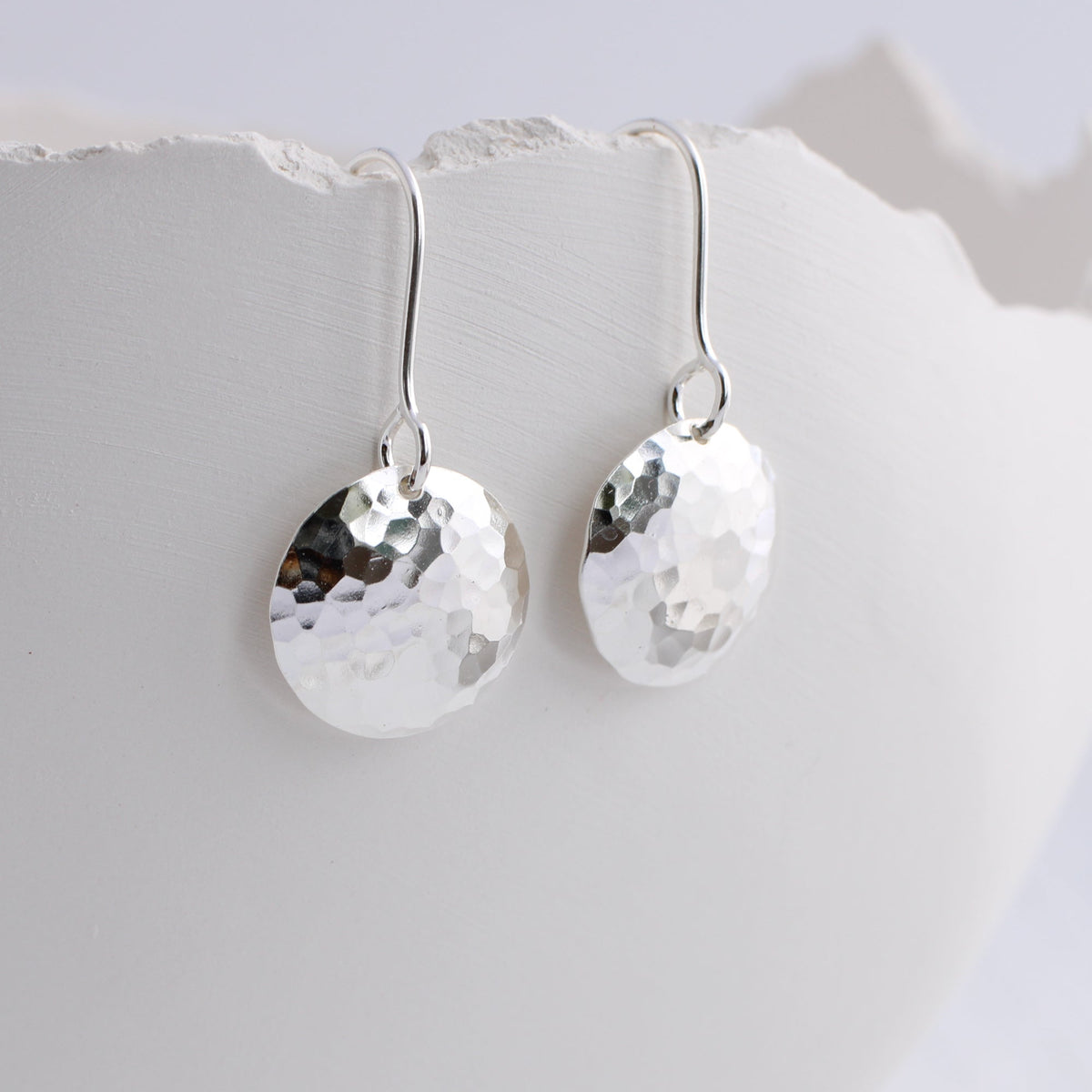 Silver hammered disc earrings