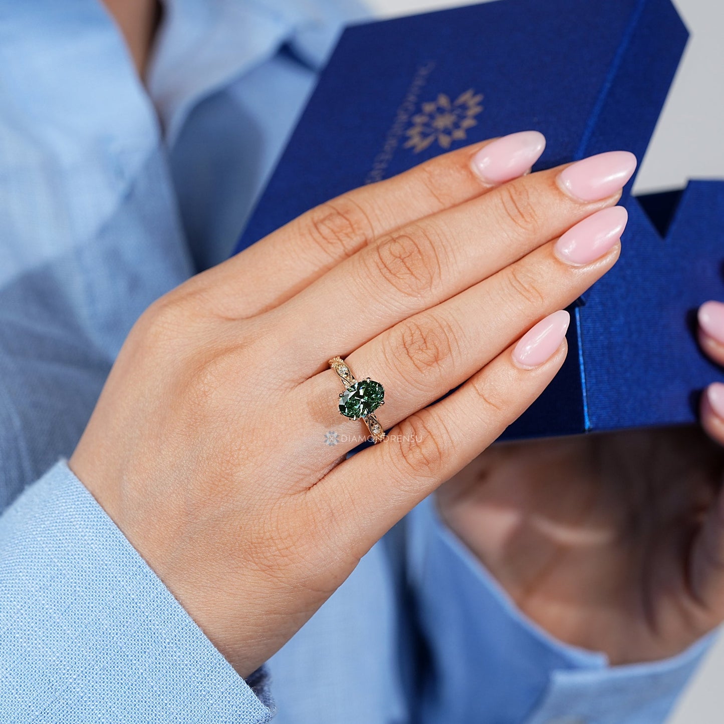 Green Oval Cut Diamond Ring with Marquise Outline Round Side Stones
