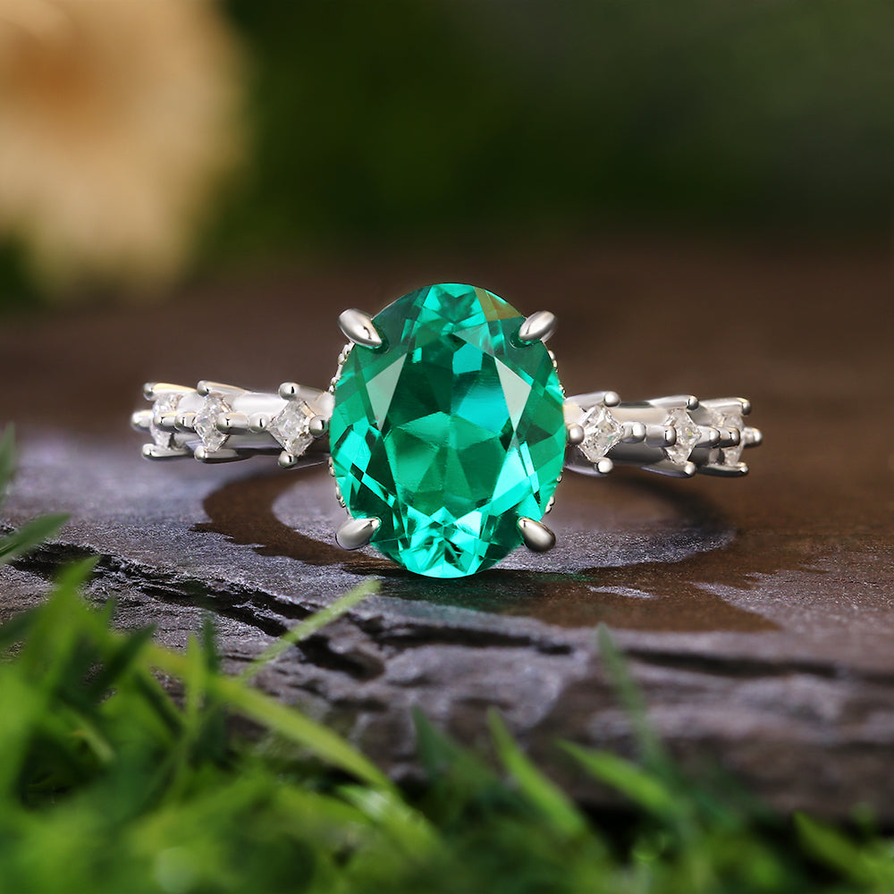 2.8 Ct Oval Cut Lab Emerald Hidden Halo with Princess Cut Moissanite Accents Vintage-Inspired Engagement Ring