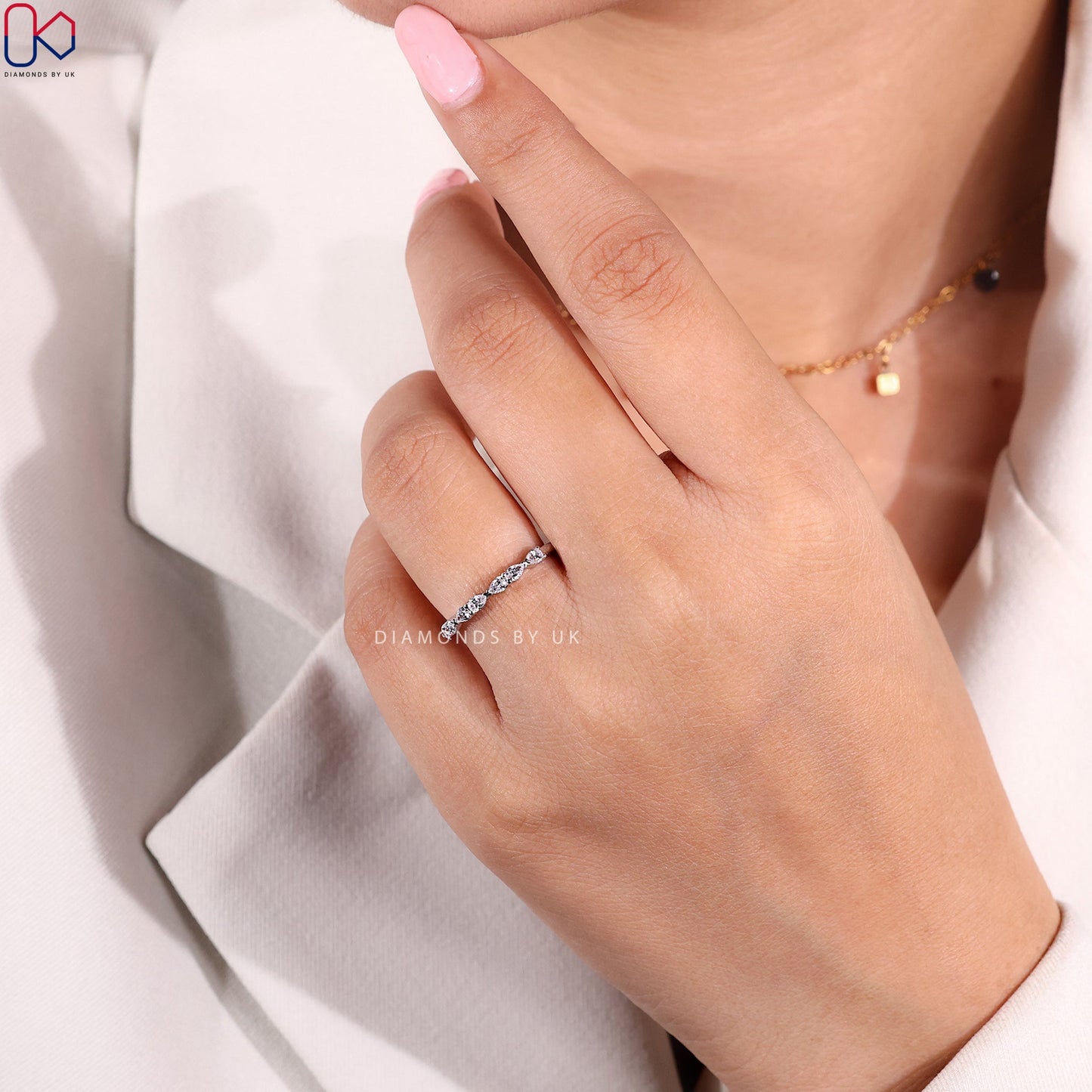 East To West Setting Pear Shaped Diamond Band