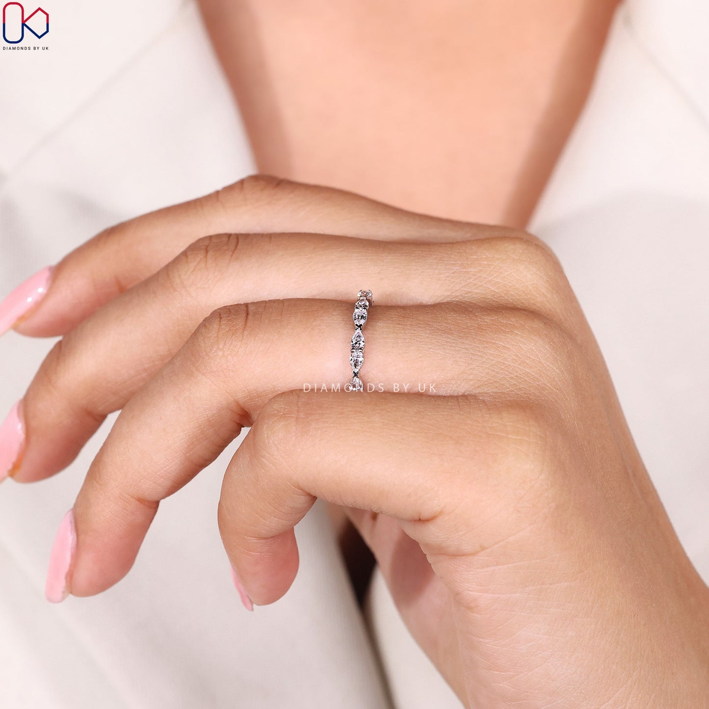 East To West Setting Pear Shaped Diamond Band