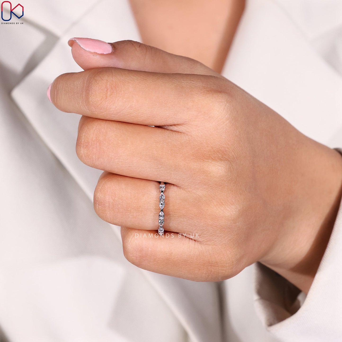 East To West Setting Pear Shaped Diamond Band
