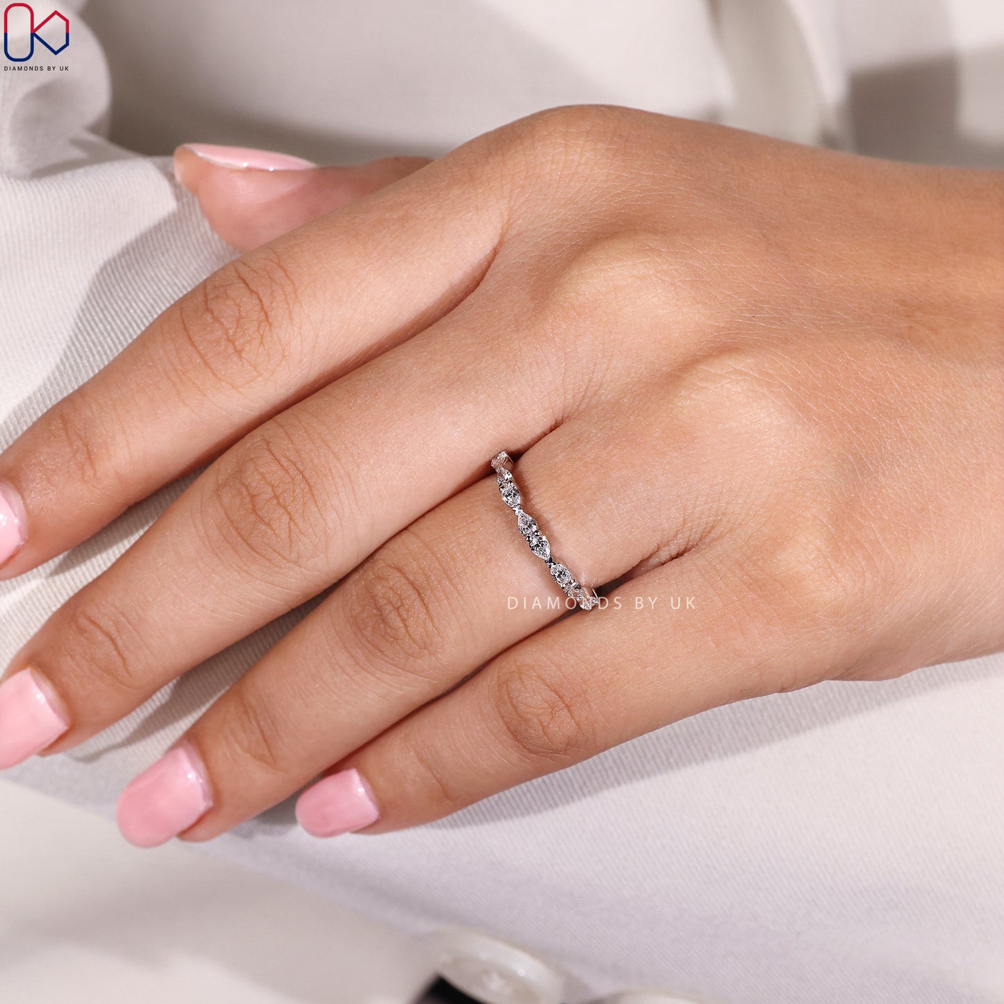 East To West Setting Pear Shaped Diamond Band