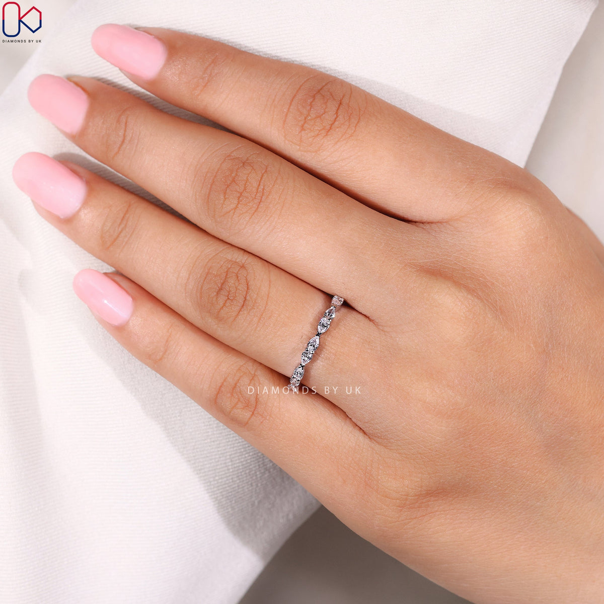 East To West Setting Pear Shaped Diamond Band