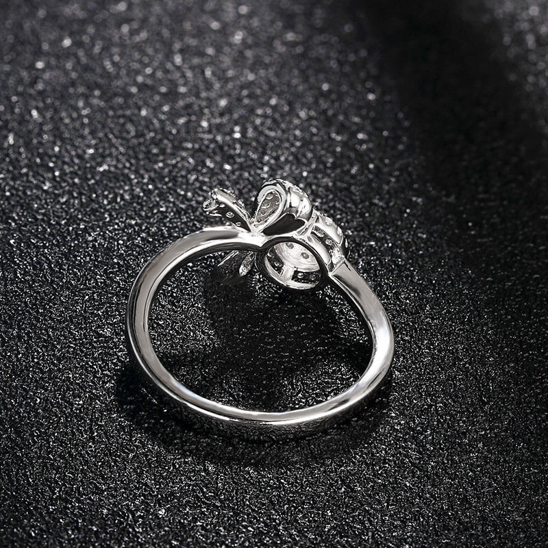 Knot And Halo Round Moissanite Cluster Engagement Ring