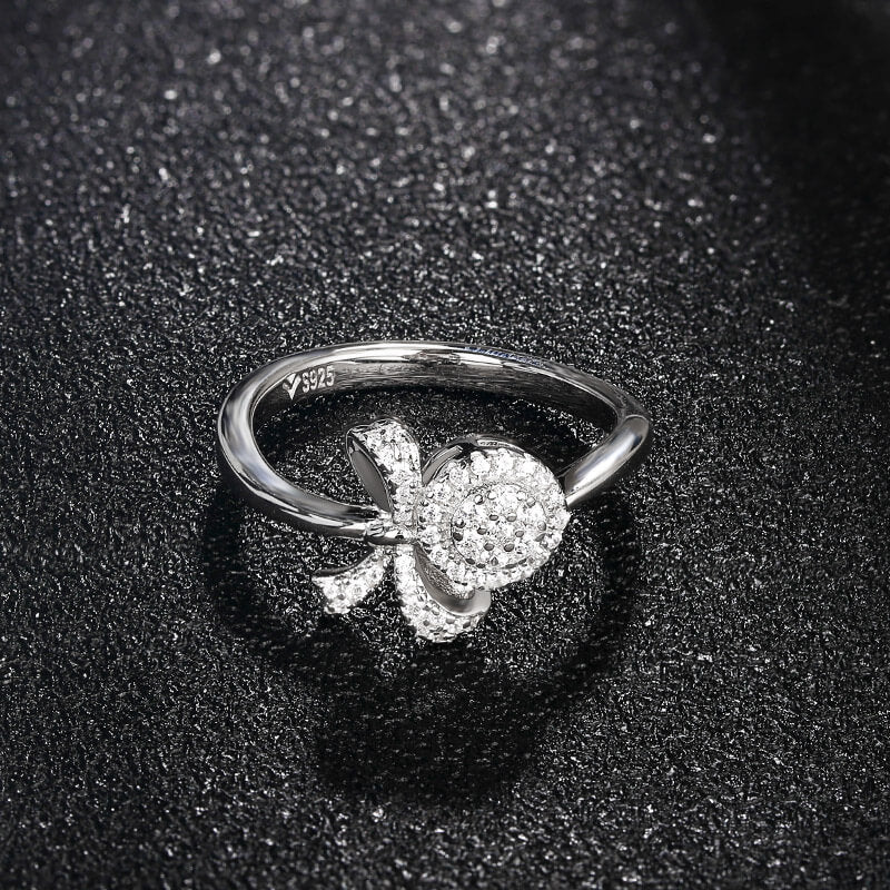 Knot And Halo Round Moissanite Cluster Engagement Ring