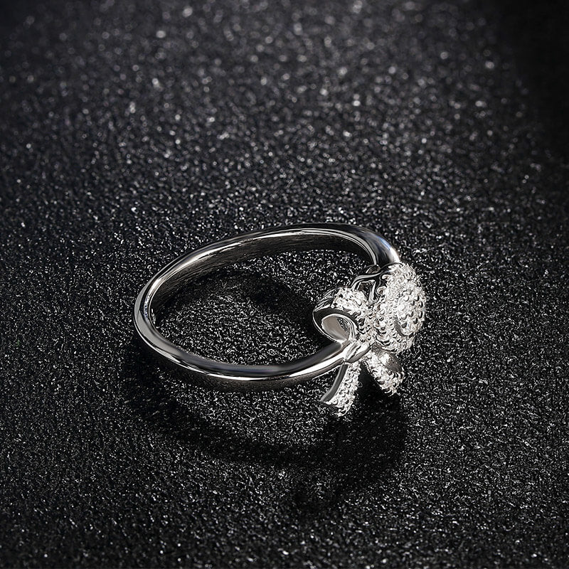 Knot And Halo Round Moissanite Cluster Engagement Ring