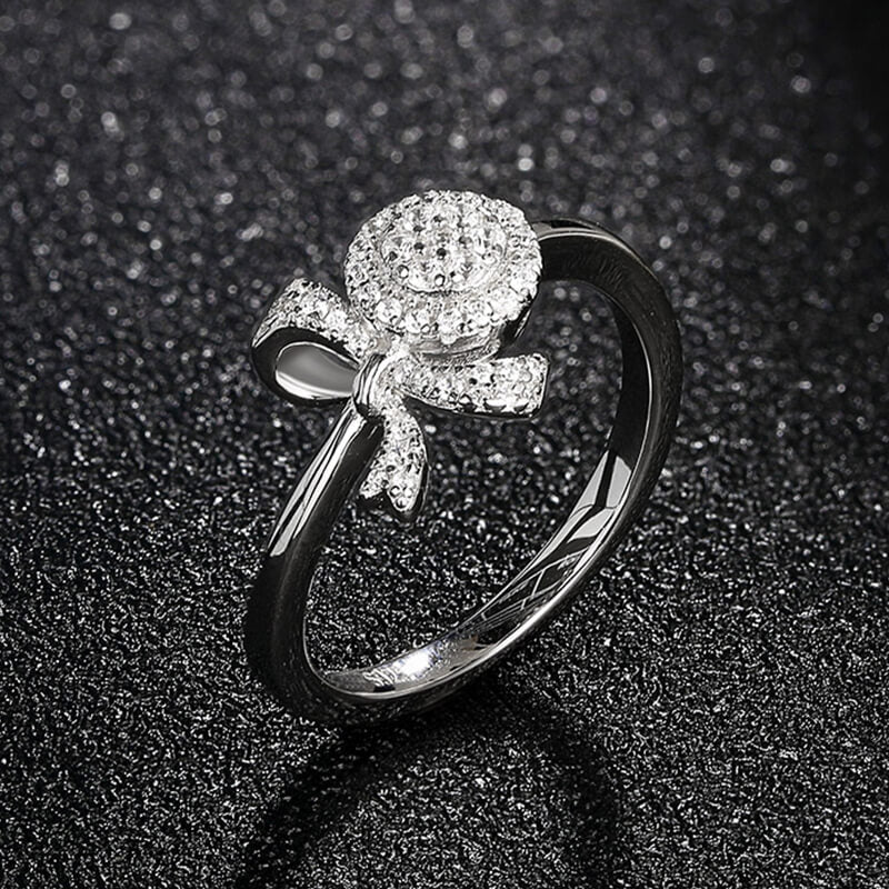 Knot And Halo Round Moissanite Cluster Engagement Ring