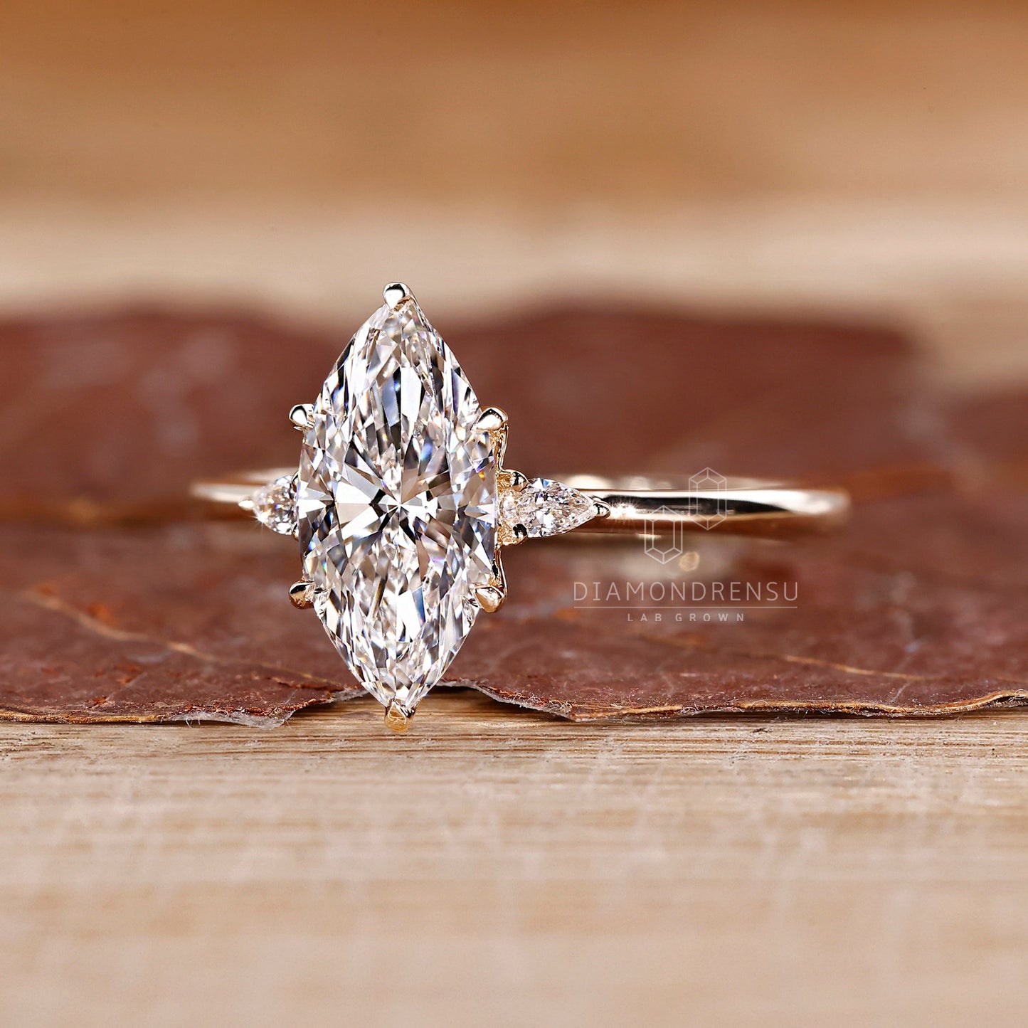 Marquise and Pear Cut Three Stone Engagement Ring