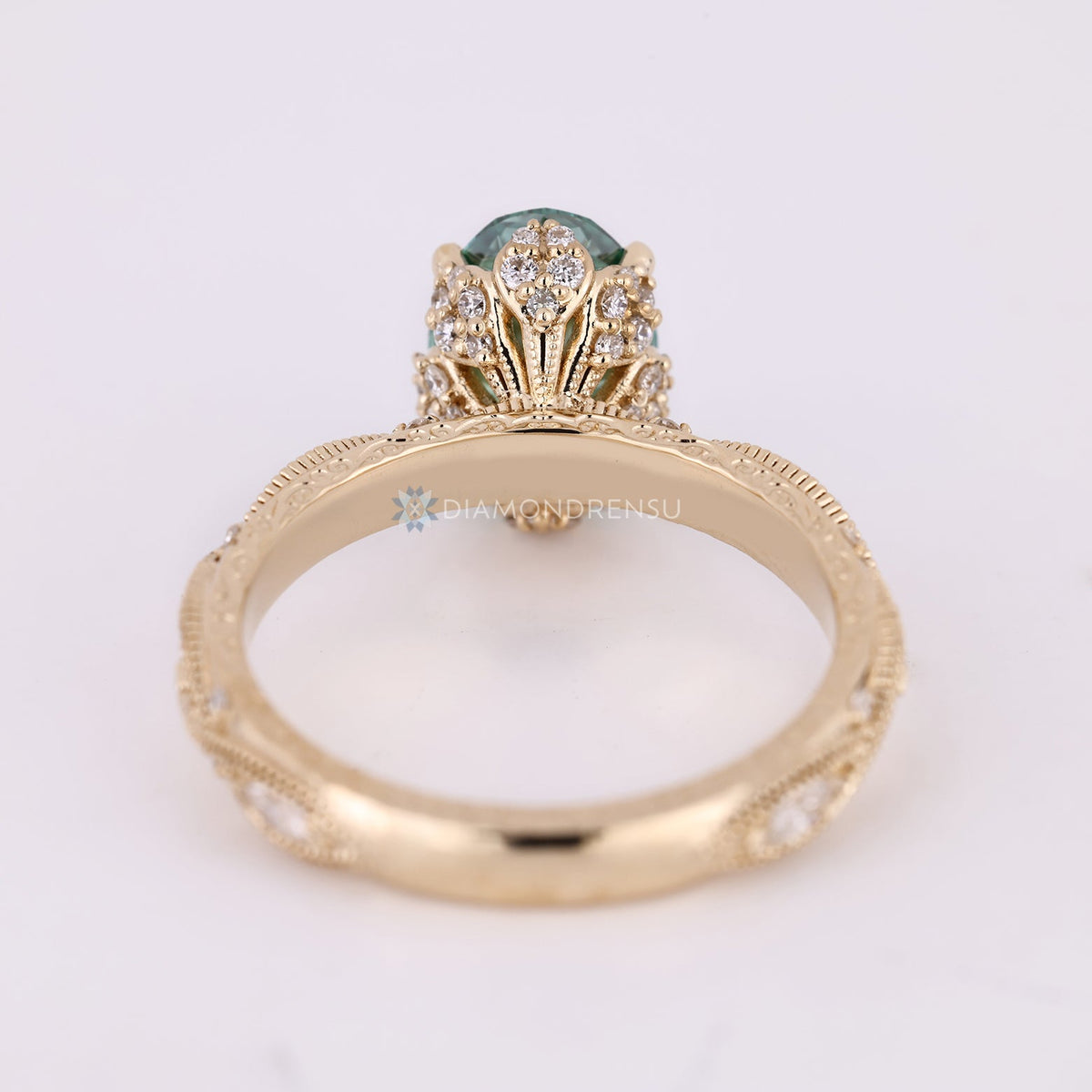 Green Oval Cut Diamond Ring with Marquise Outline Round Side Stones