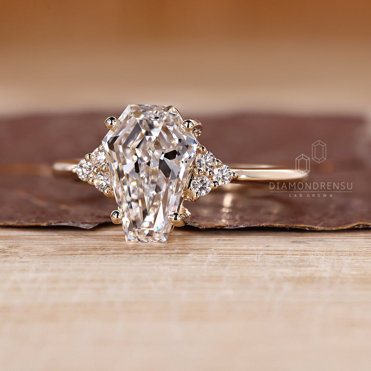 Coffin Cut Diamond Ring with Round Side Stones and Muse Setting