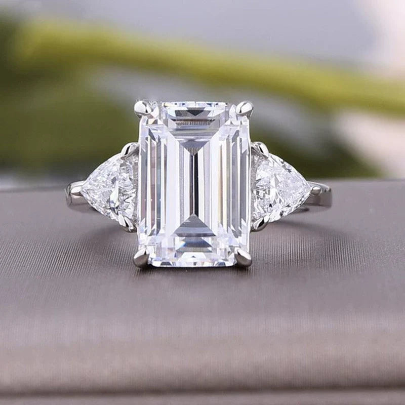 Deluxe Emerald Cut 7.5ct Three Stone Engagement Ring In Sterling Silver