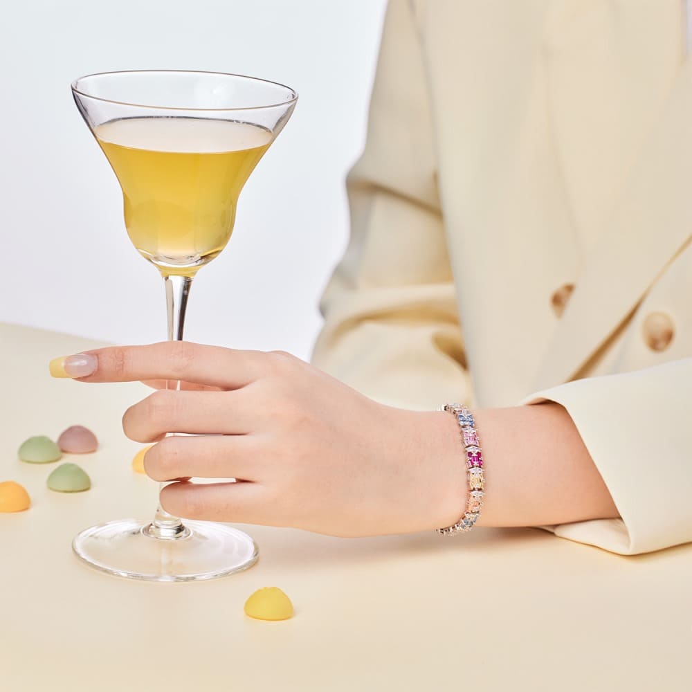 An Ethereal Trapezoidal Cut, Emerald Cut, and Round Cut Women's Bracelet adorned with Pink, White, and Yellow Stones