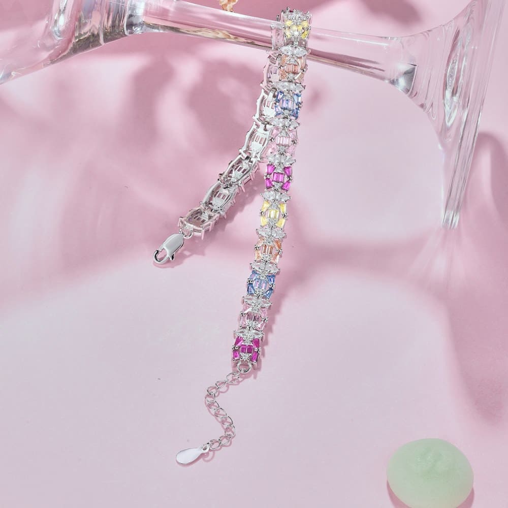 An Ethereal Trapezoidal Cut, Emerald Cut, and Round Cut Women's Bracelet adorned with Pink, White, and Yellow Stones