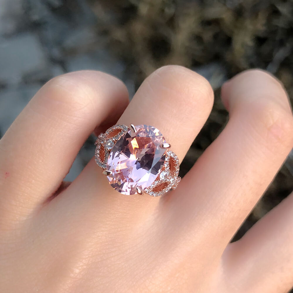 Oval Cut Pink Sapphire Leaf Accents Sterling Silver Ring