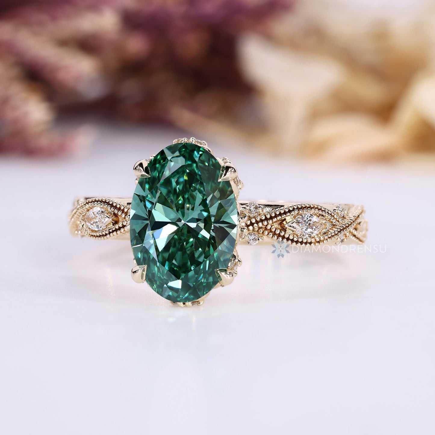 Green Oval Cut Diamond Ring with Marquise Outline Round Side Stones
