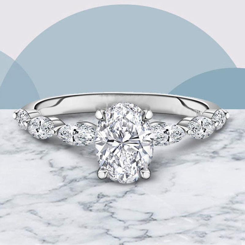 Oval Moissanite With Marquise Accents Engagement Ring