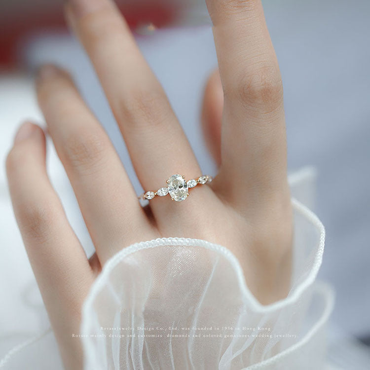 Oval Moissanite With Marquise Accents Engagement Ring