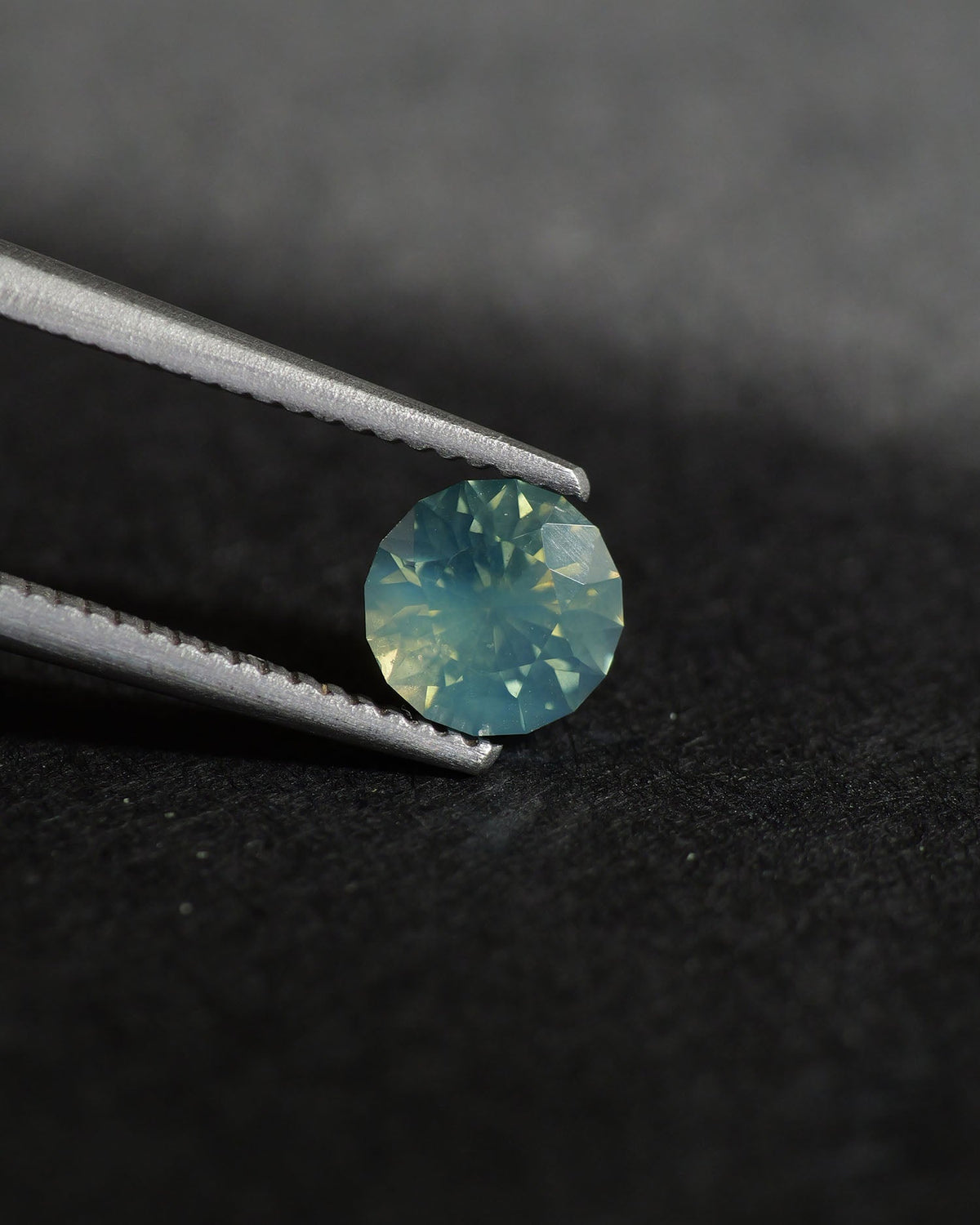Opalescent Sapphire | natural, multicolor: blue, green & yellow, round-cut, 5mm, 0.73ct, Madagascar