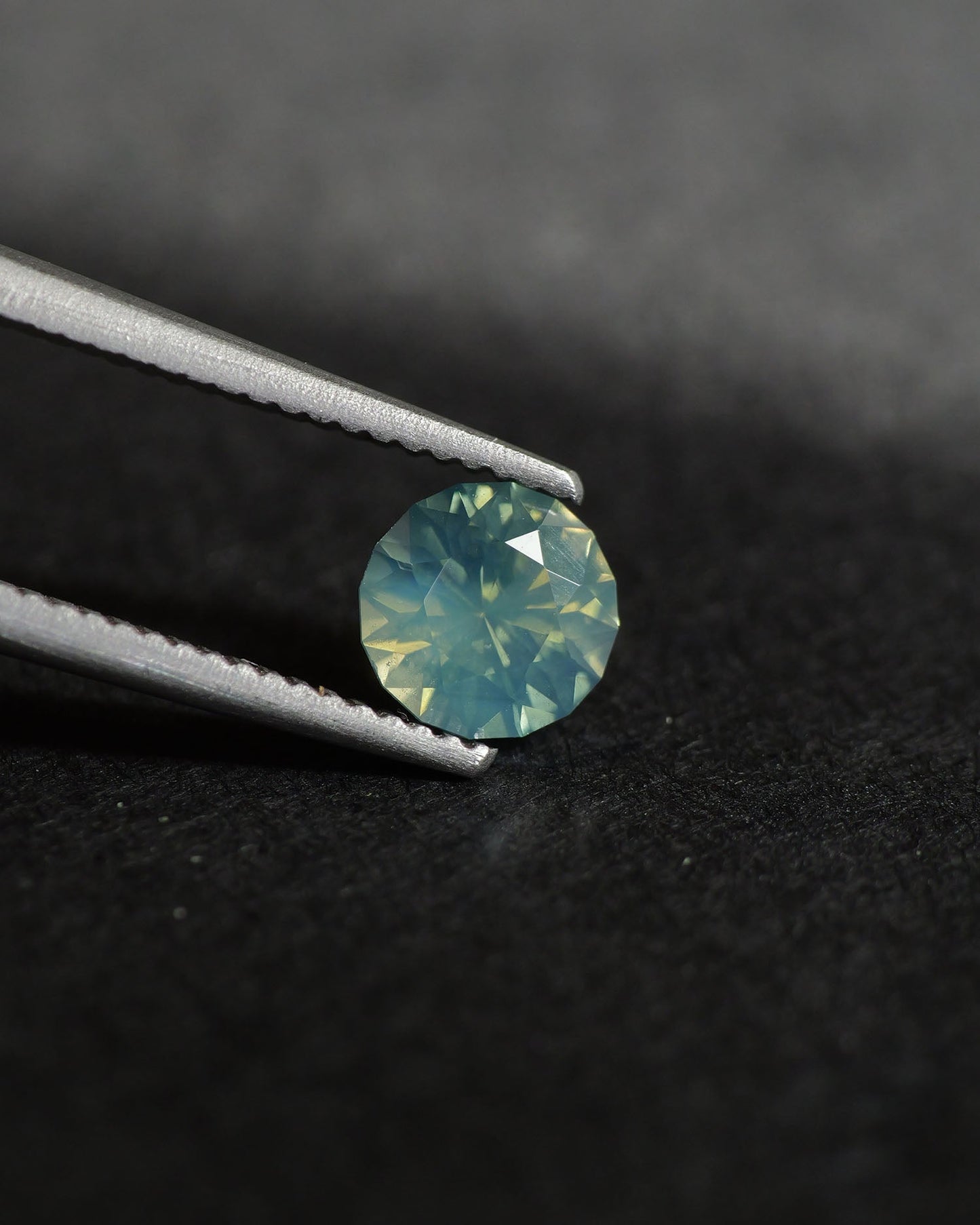 Opalescent Sapphire | natural, multicolor: blue, green & yellow, round-cut, 5mm, 0.73ct, Madagascar