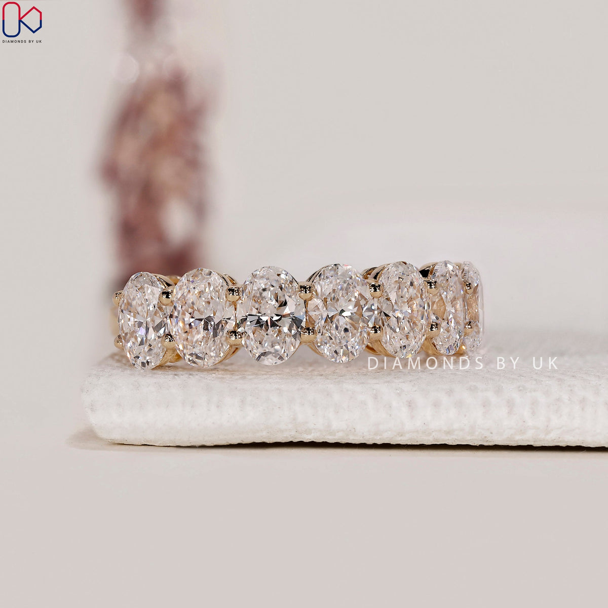 Half Eternity Oval Cut Diamond Band