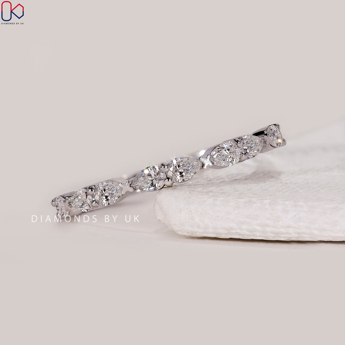 East To West Setting Pear Shaped Diamond Band