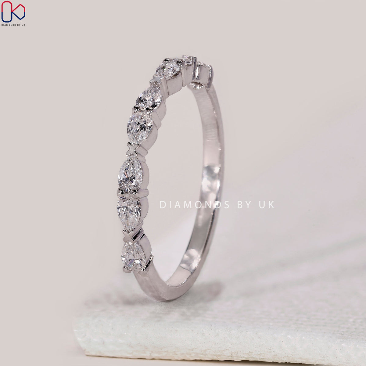 East To West Setting Pear Shaped Diamond Band