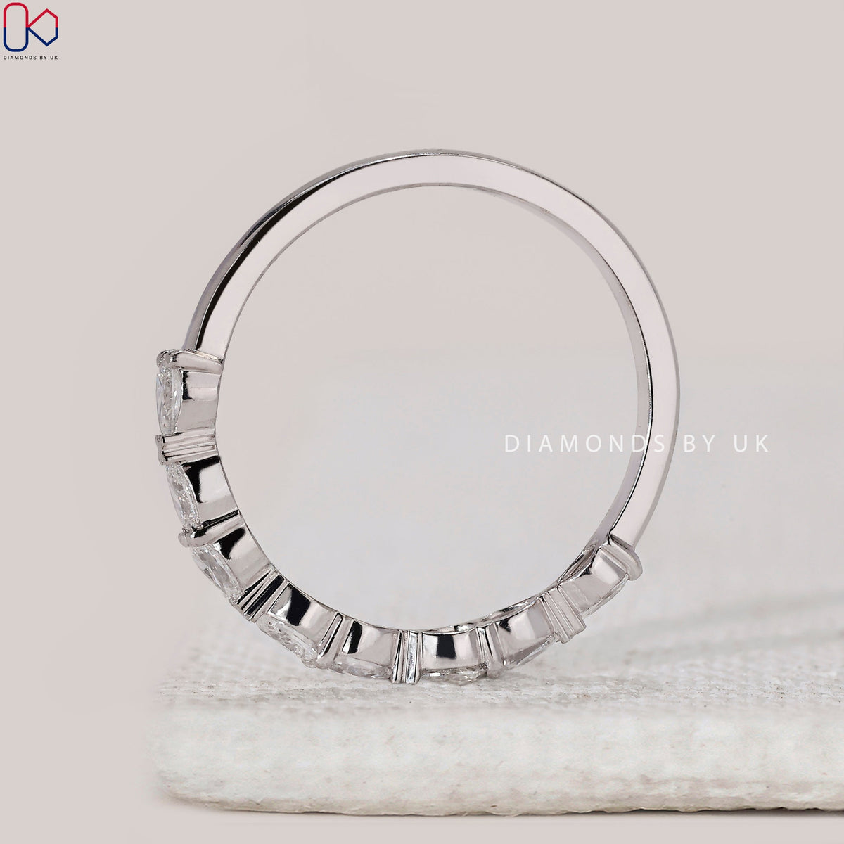 East To West Setting Pear Shaped Diamond Band