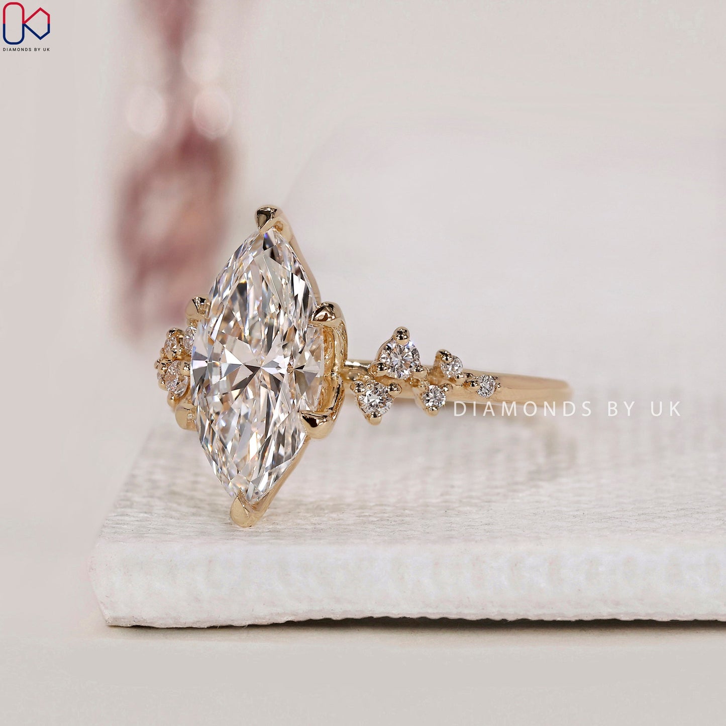 Yellow Gold Marquise Engagement Ring with Side Stone