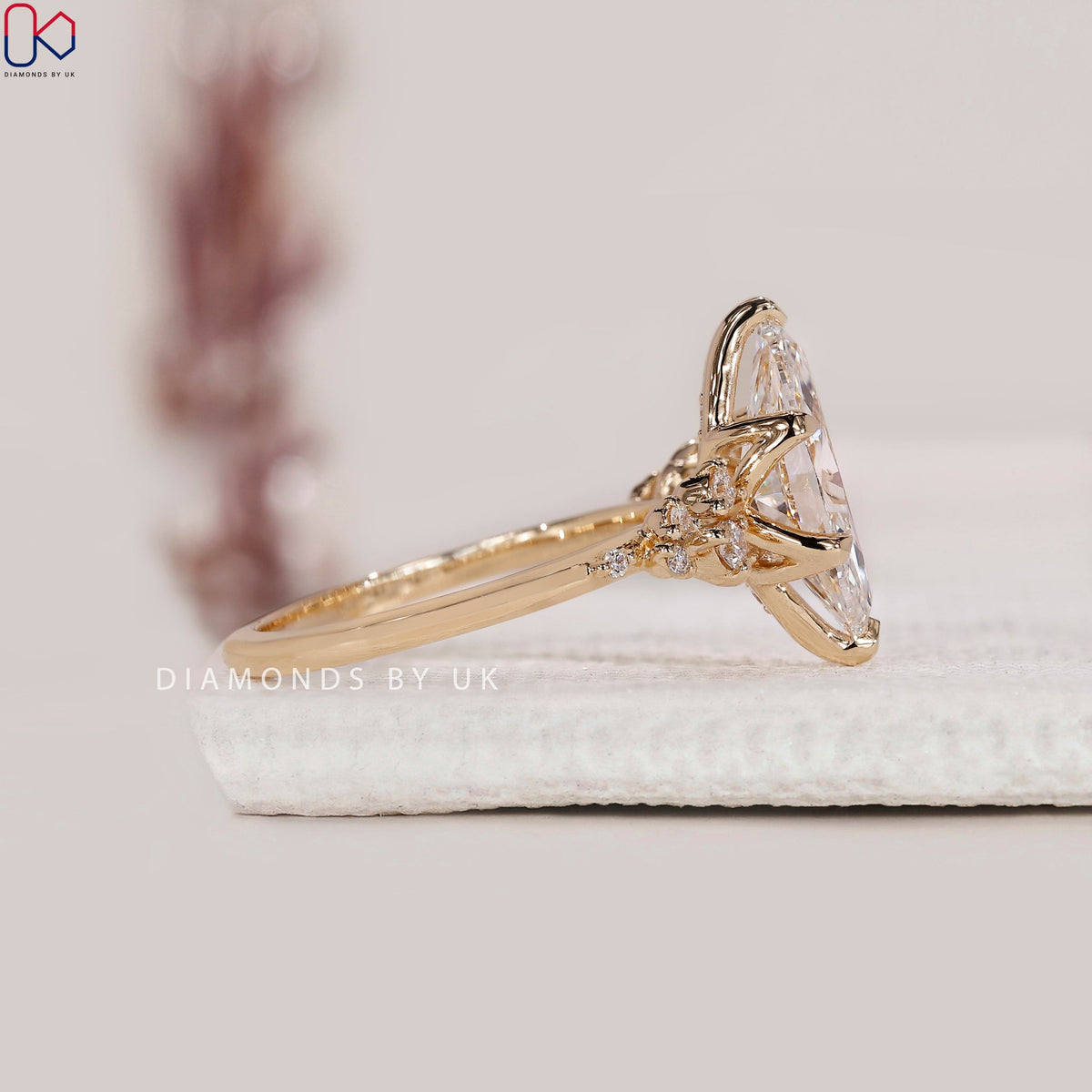 Yellow Gold Marquise Engagement Ring with Side Stone