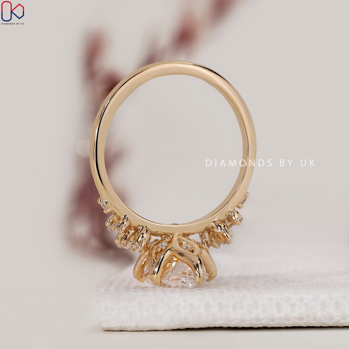 Yellow Gold Marquise Engagement Ring with Side Stone