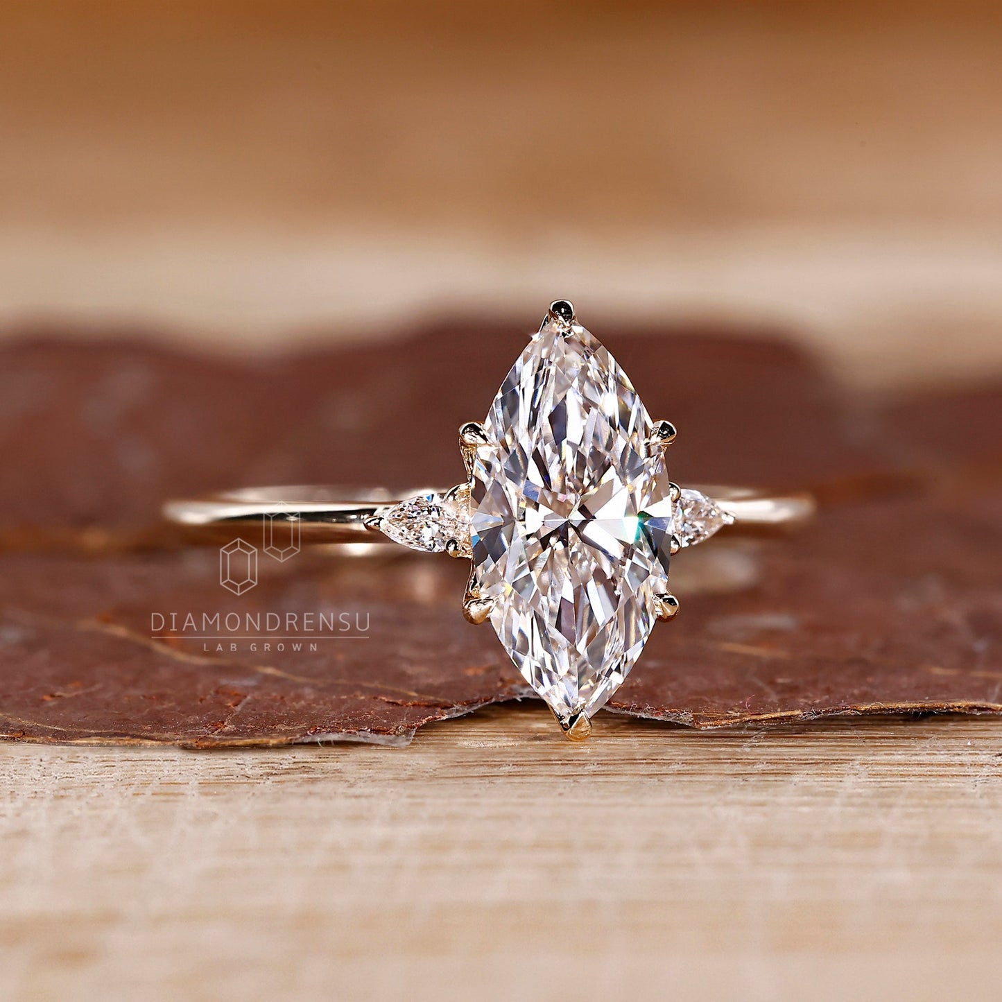 Marquise and Pear Cut Three Stone Engagement Ring