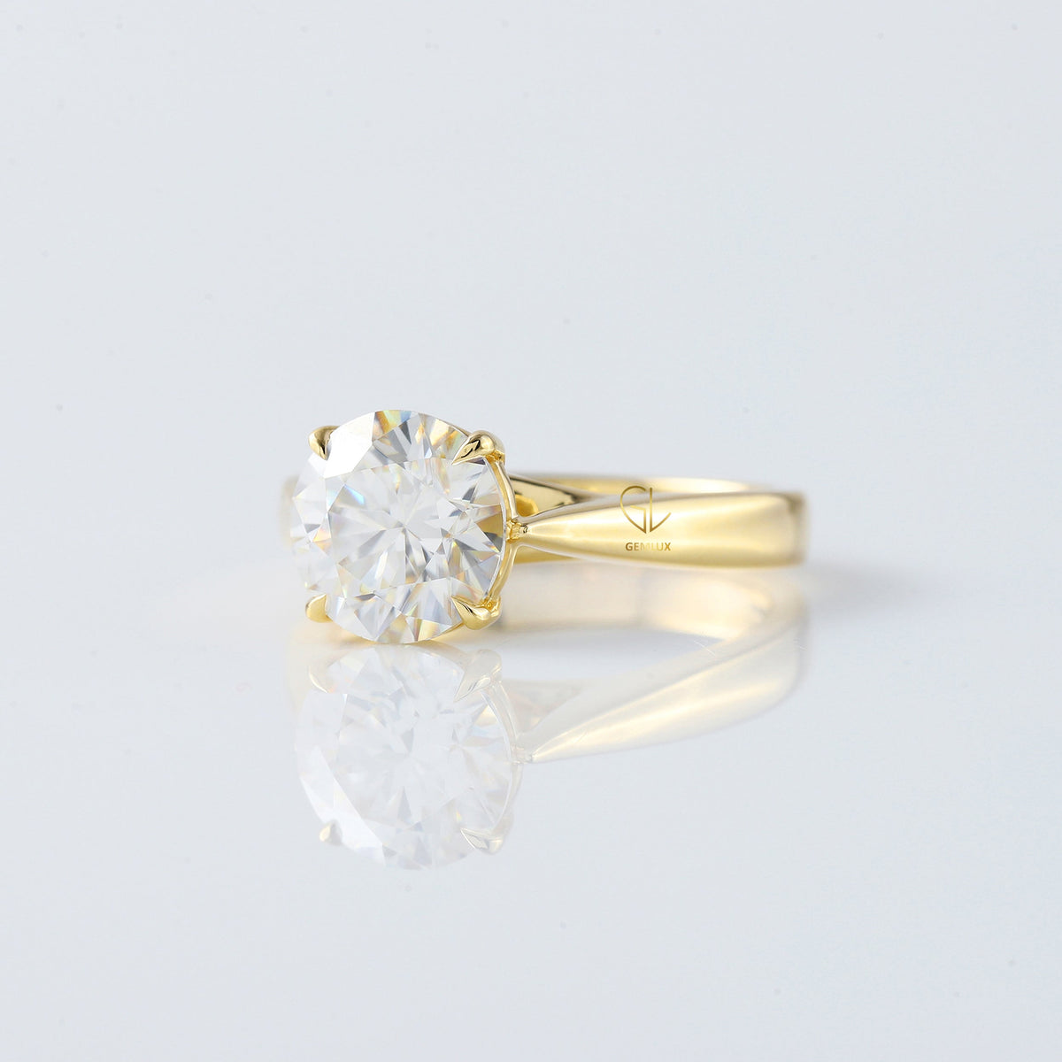Pinch Style Round Moissanite Solitaire Engagement Ring