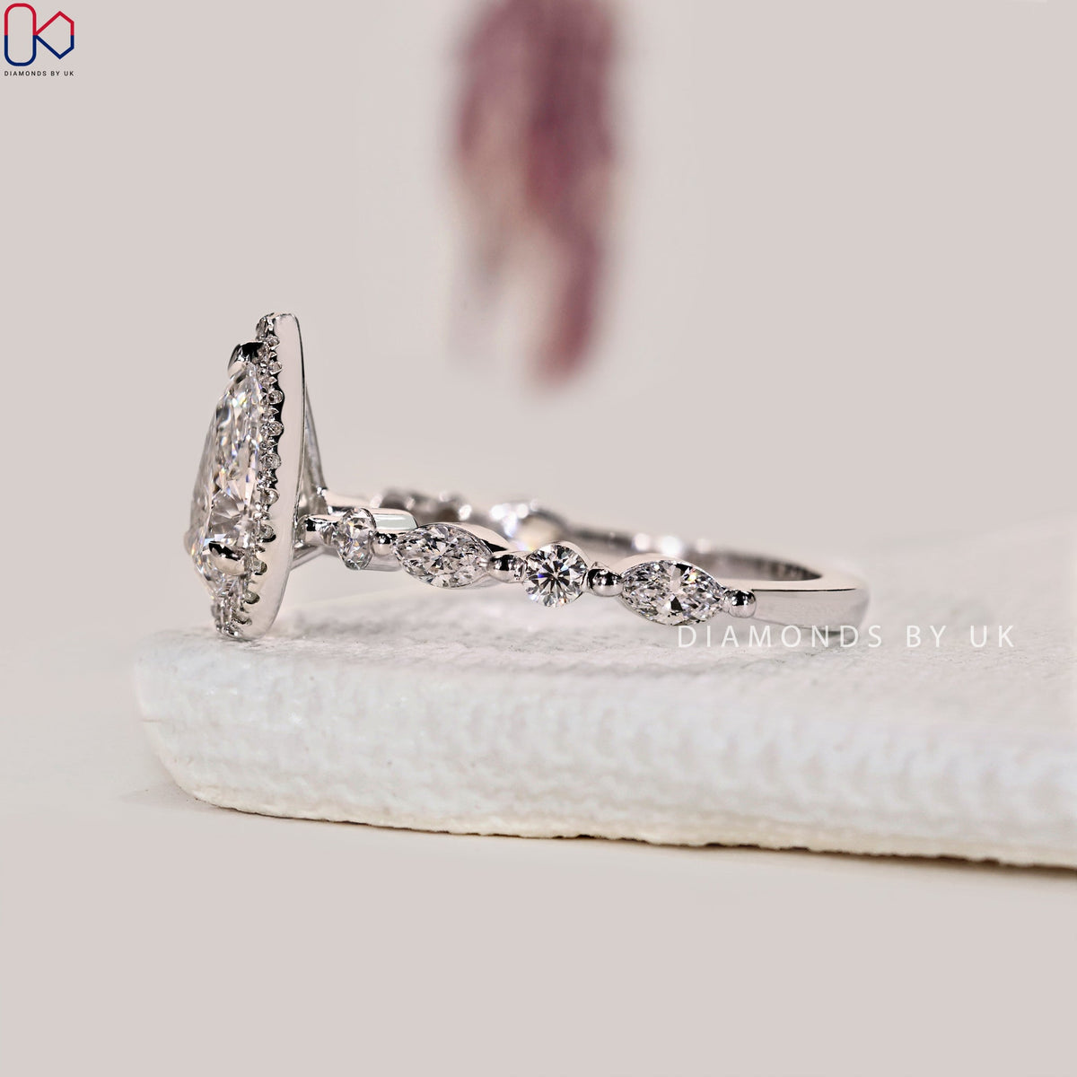 Pear Shape Engagement Ring With Floating Bubble Prong
