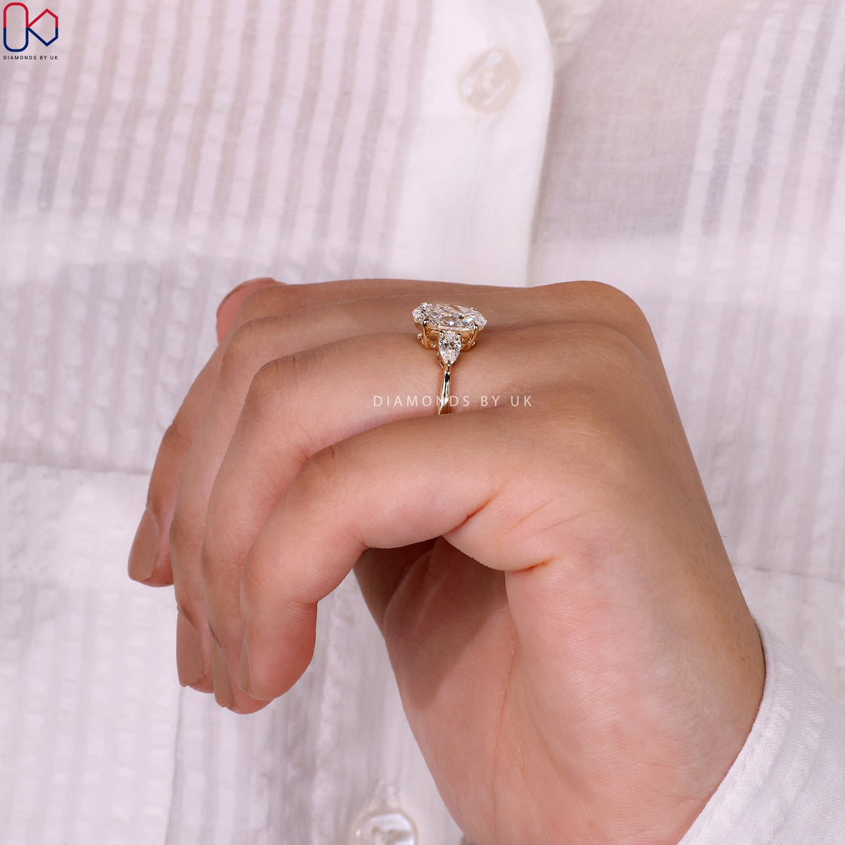 3 Stone Engagement Ring - Oval and Pear Diamond