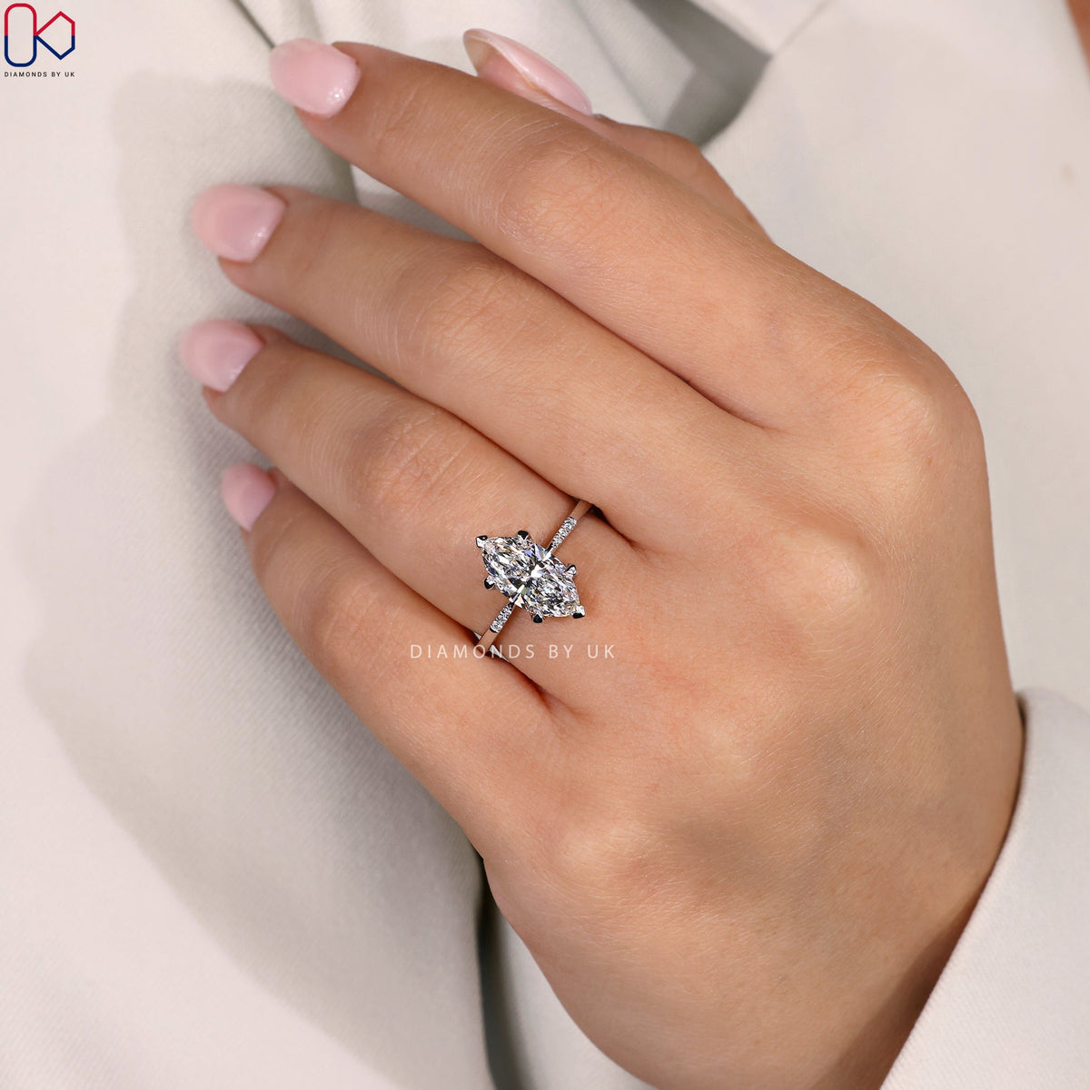 Marquise Diamond Engagement Ring with Round Side Accents