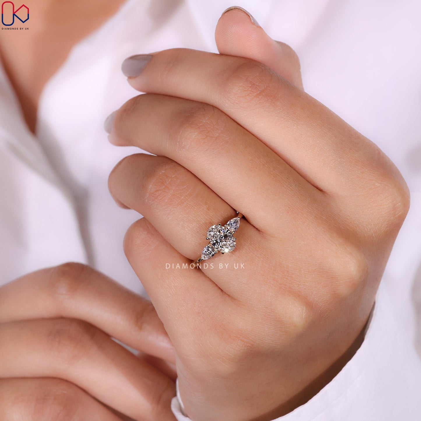3 Stone Diamond Engagement Ring In Oval And Pear Cut Stone