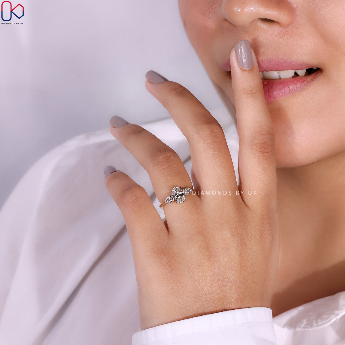 3 Stone Diamond Engagement Ring In Oval And Pear Cut Stone