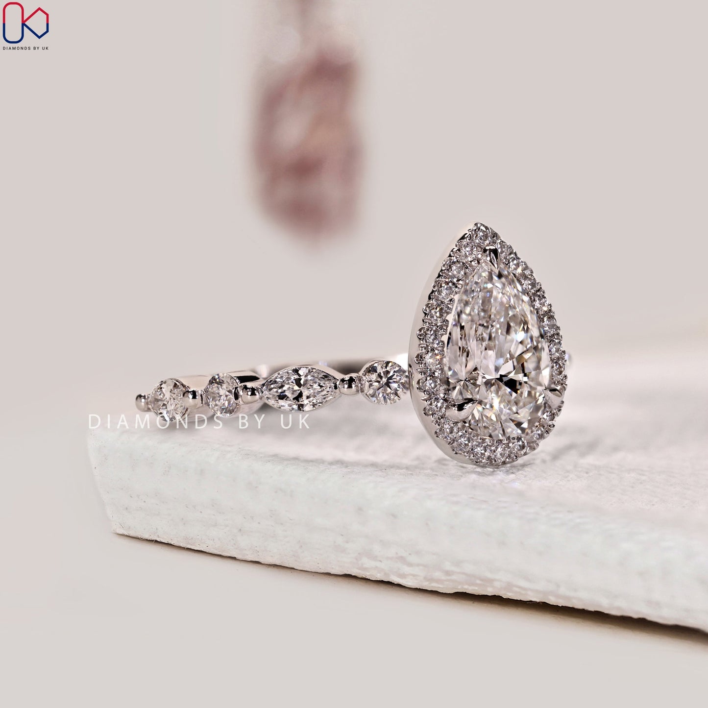 Pear Shape Engagement Ring With Floating Bubble Prong