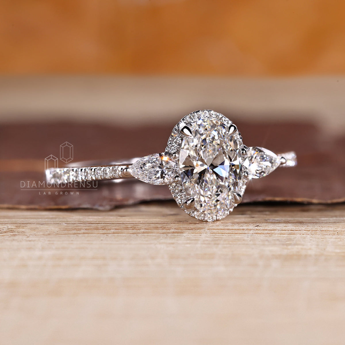 Oval Cut Engagement Ring with Pear Side Stone