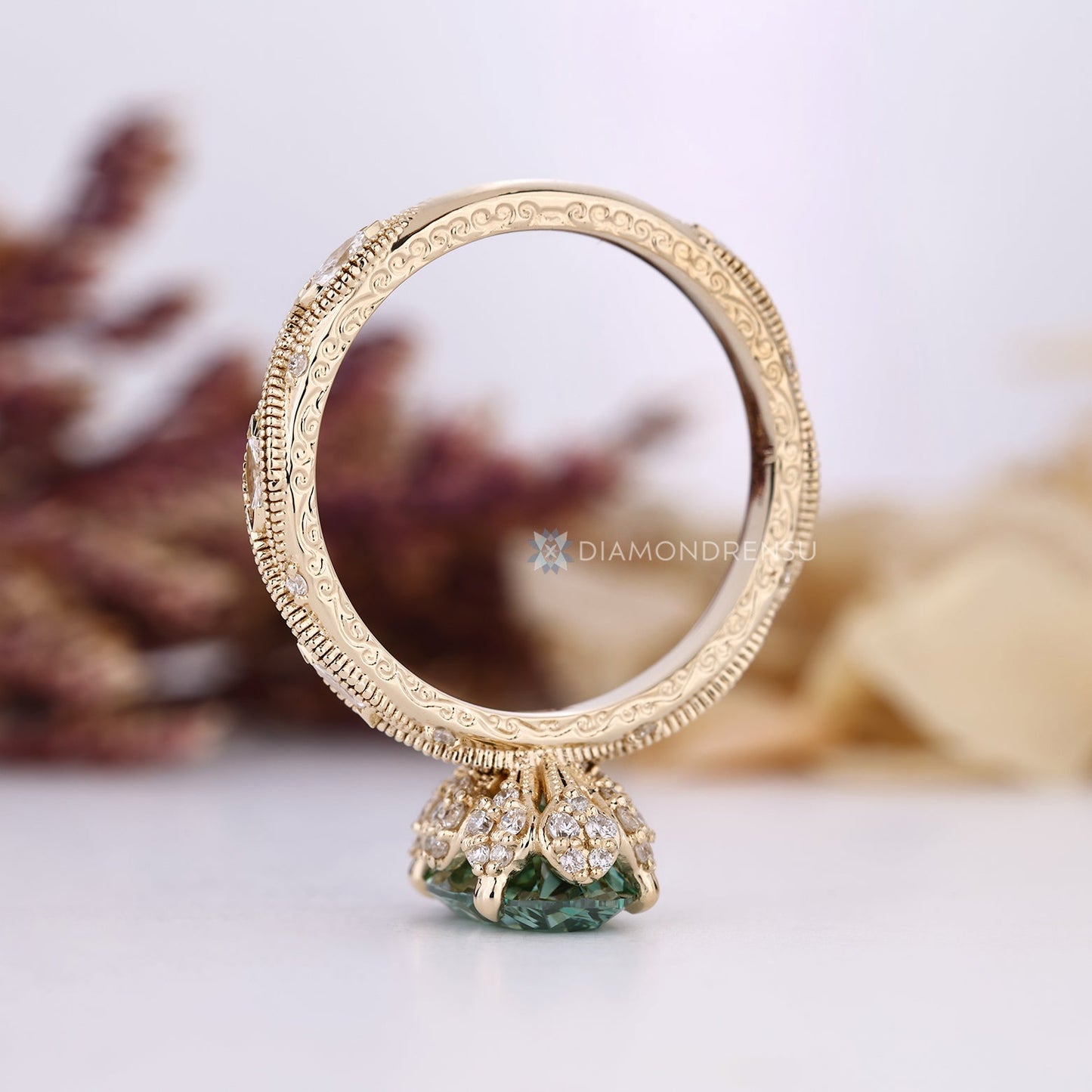 Green Oval Cut Diamond Ring with Marquise Outline Round Side Stones