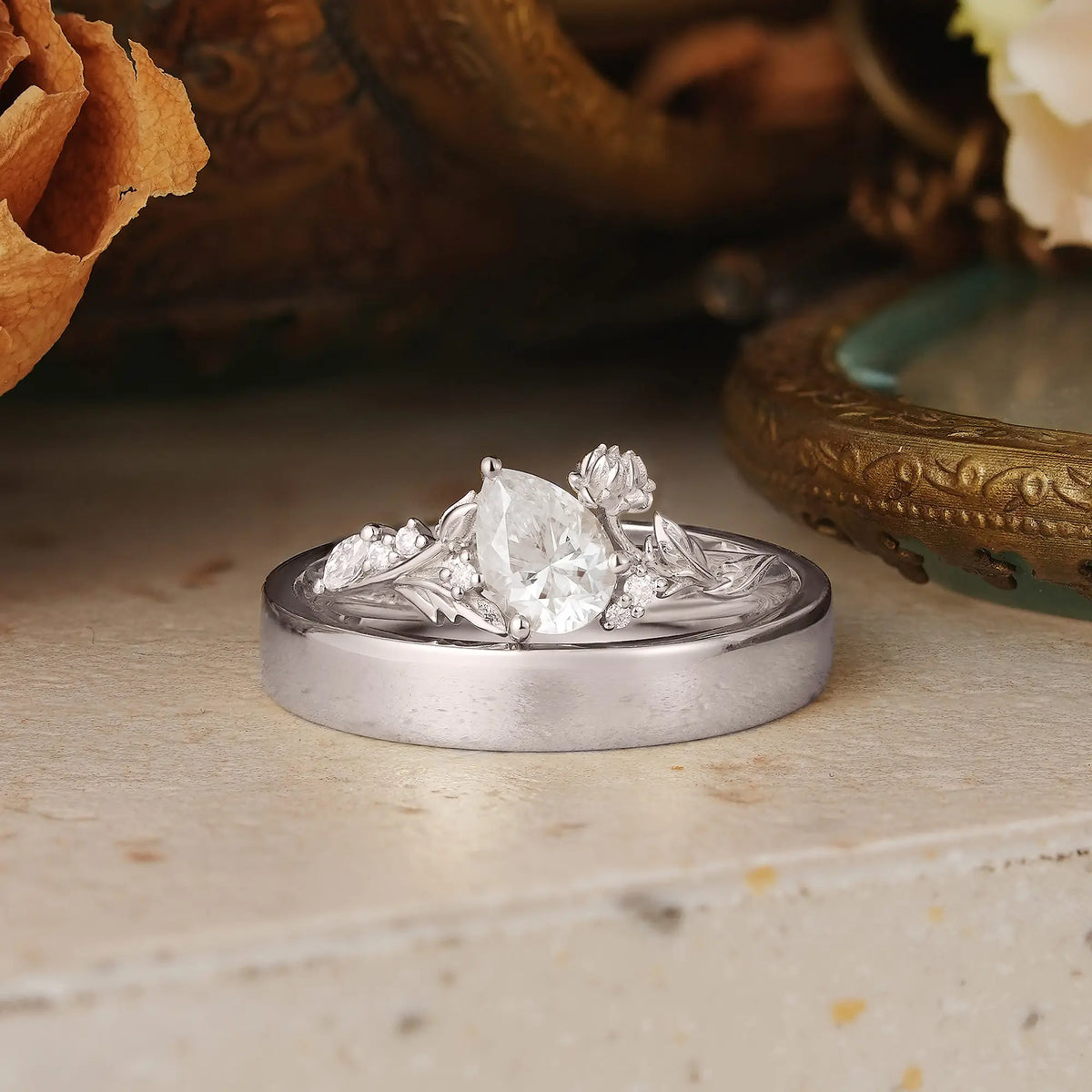Snow Lotus Flower Inspired Pear Cut Moissanite Tilted Couple Wedding Ring Set - Kara & Evren | GemsMagic