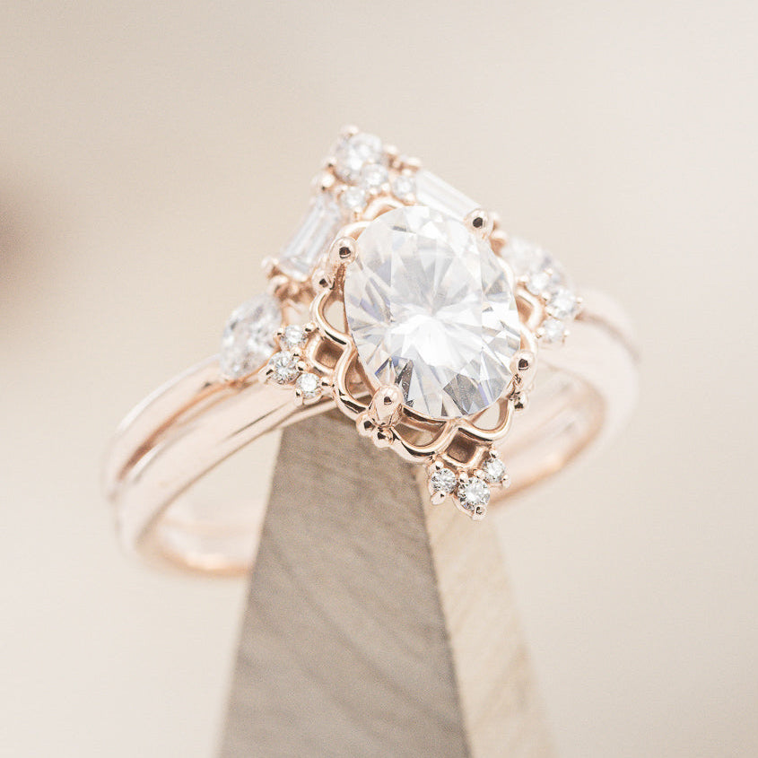 "Treva" - Oval Moissanite Engagement Ring With Diamond Accents & "Melody" Tracer