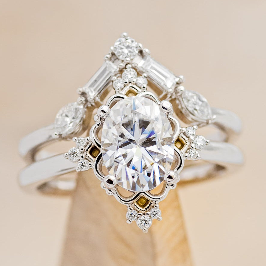 "Treva" - Oval Moissanite Engagement Ring With Diamond Accents & "Melody" Tracer