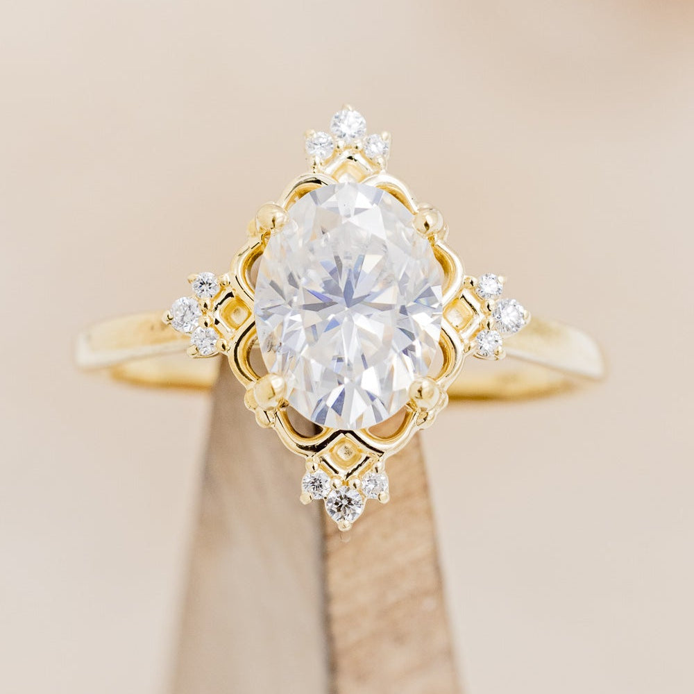 "Treva" - Oval Moissanite Engagement Ring With Diamond Accents & "Melody" Tracer