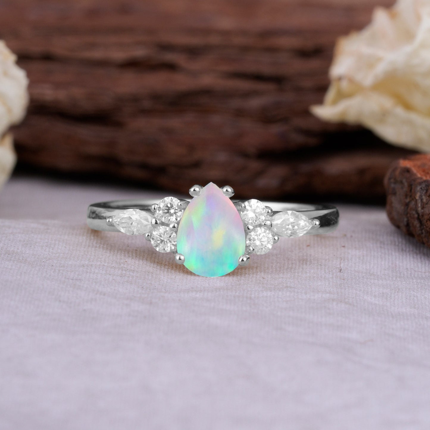 Sophisticated 4-Prong Pear-Cut Fire Opal Engagement Ring
