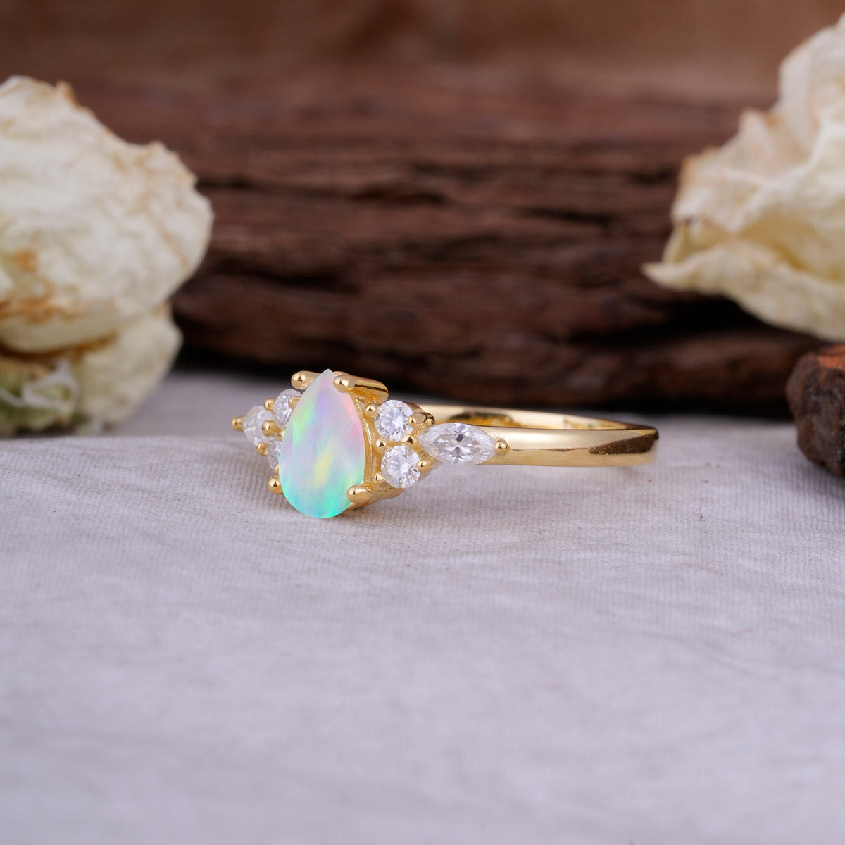 Sophisticated 4-Prong Pear-Cut Fire Opal Engagement Ring