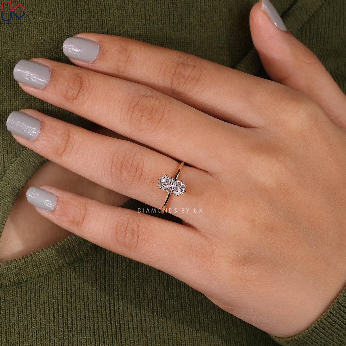 Elongated Radiant Cut Diamond Ring In Yellow Gold