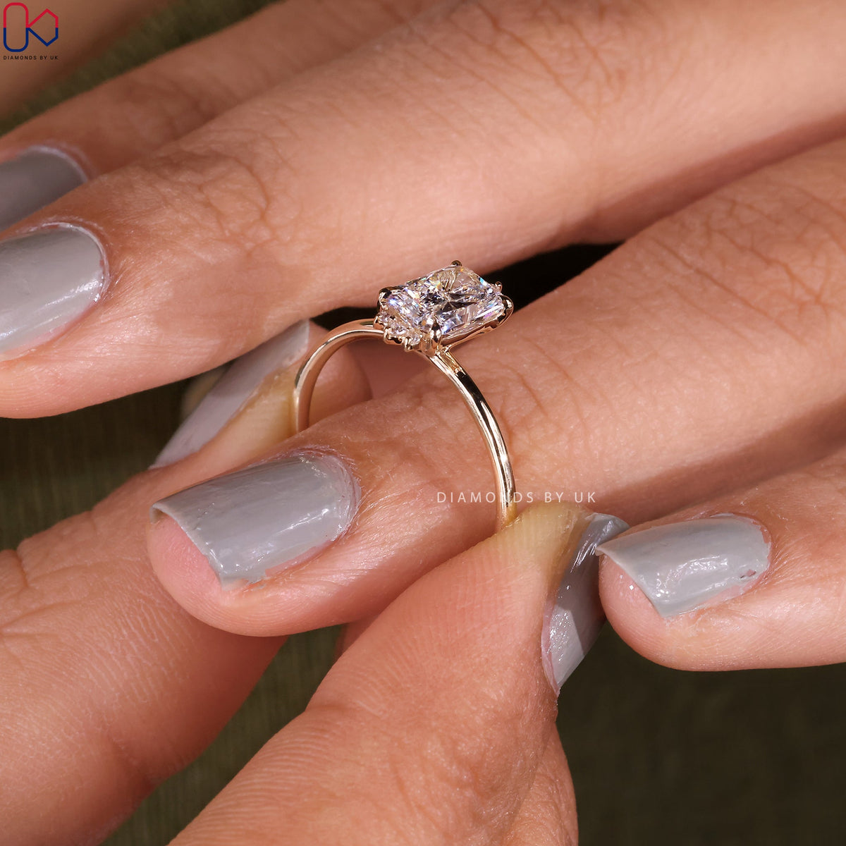 Elongated Radiant Cut Diamond Ring In Yellow Gold
